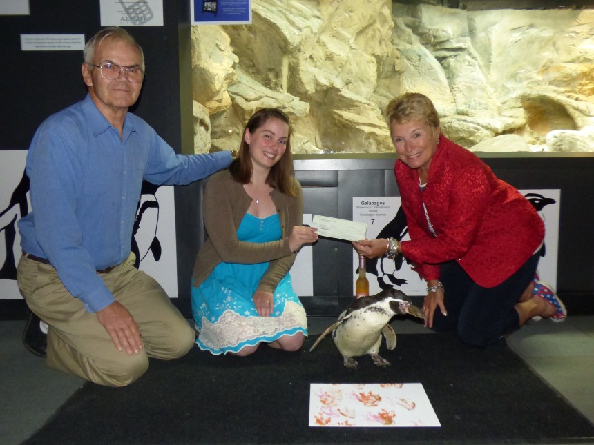 Long Cliff Winery Danielle DeMaison and Don DeMaison present AON Executive Director Gay Molnar and Opus with donation from penguin wine sales (4)